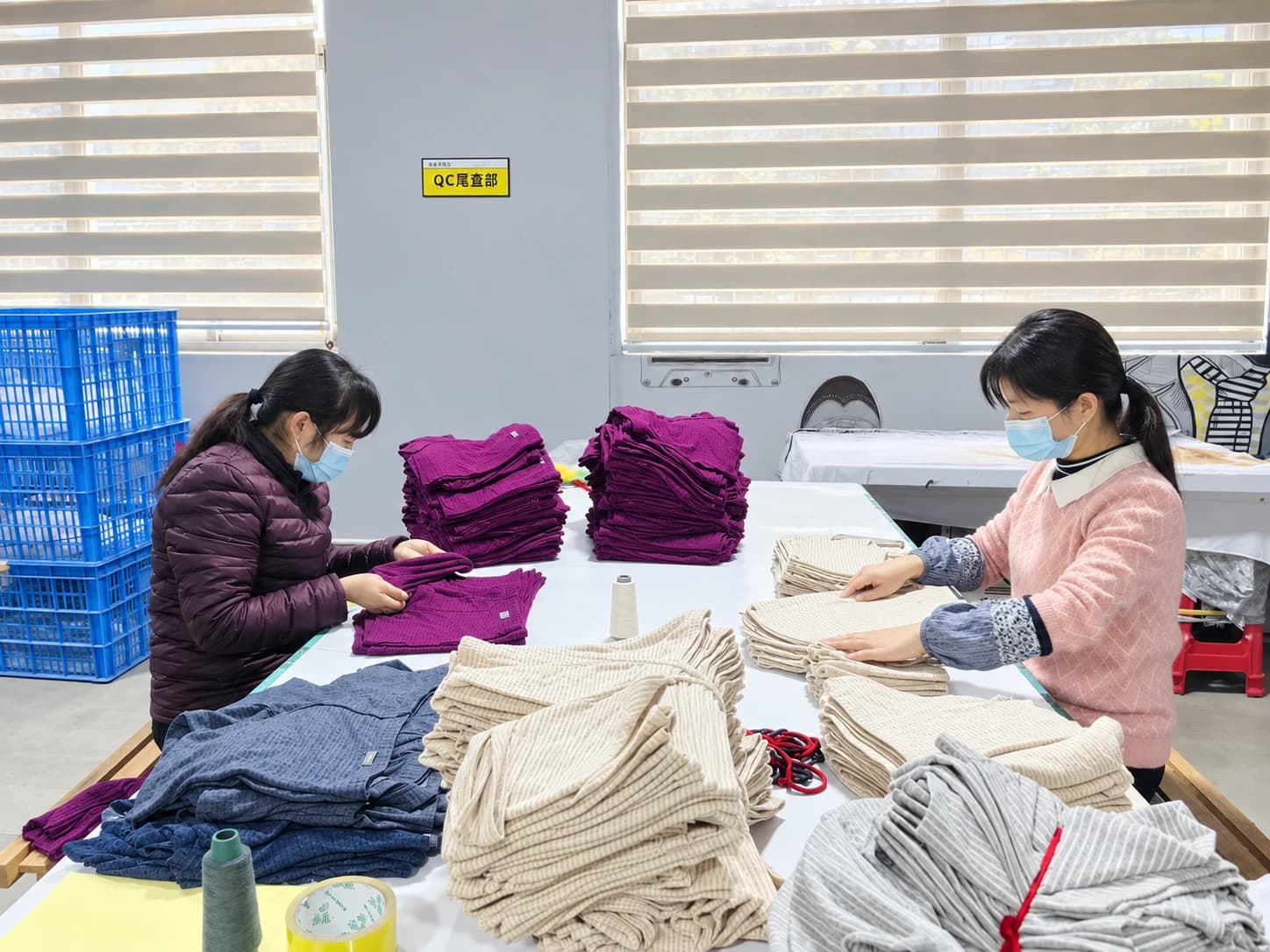 QC staff inspecting finished underwear at the final inspection station